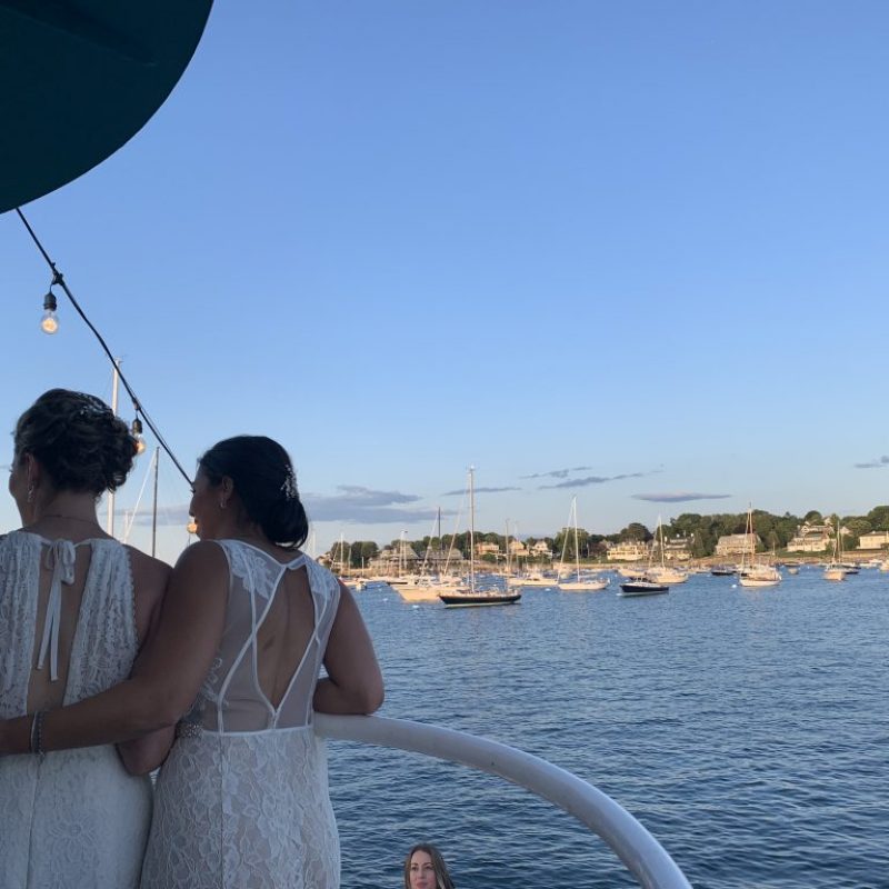 Two brides on a boat in Salem Harbor